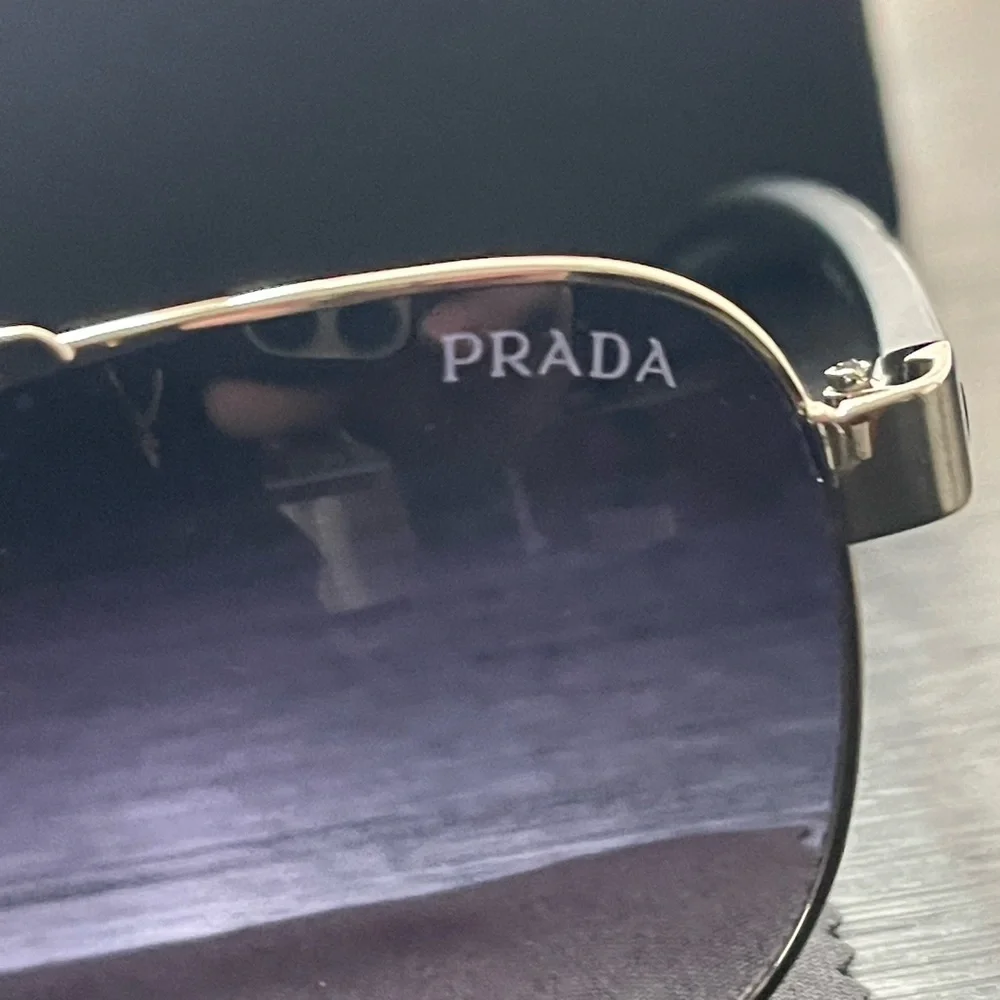 Prada Silver Aviator Sunglasses with Dark Blue and Purple Lenses